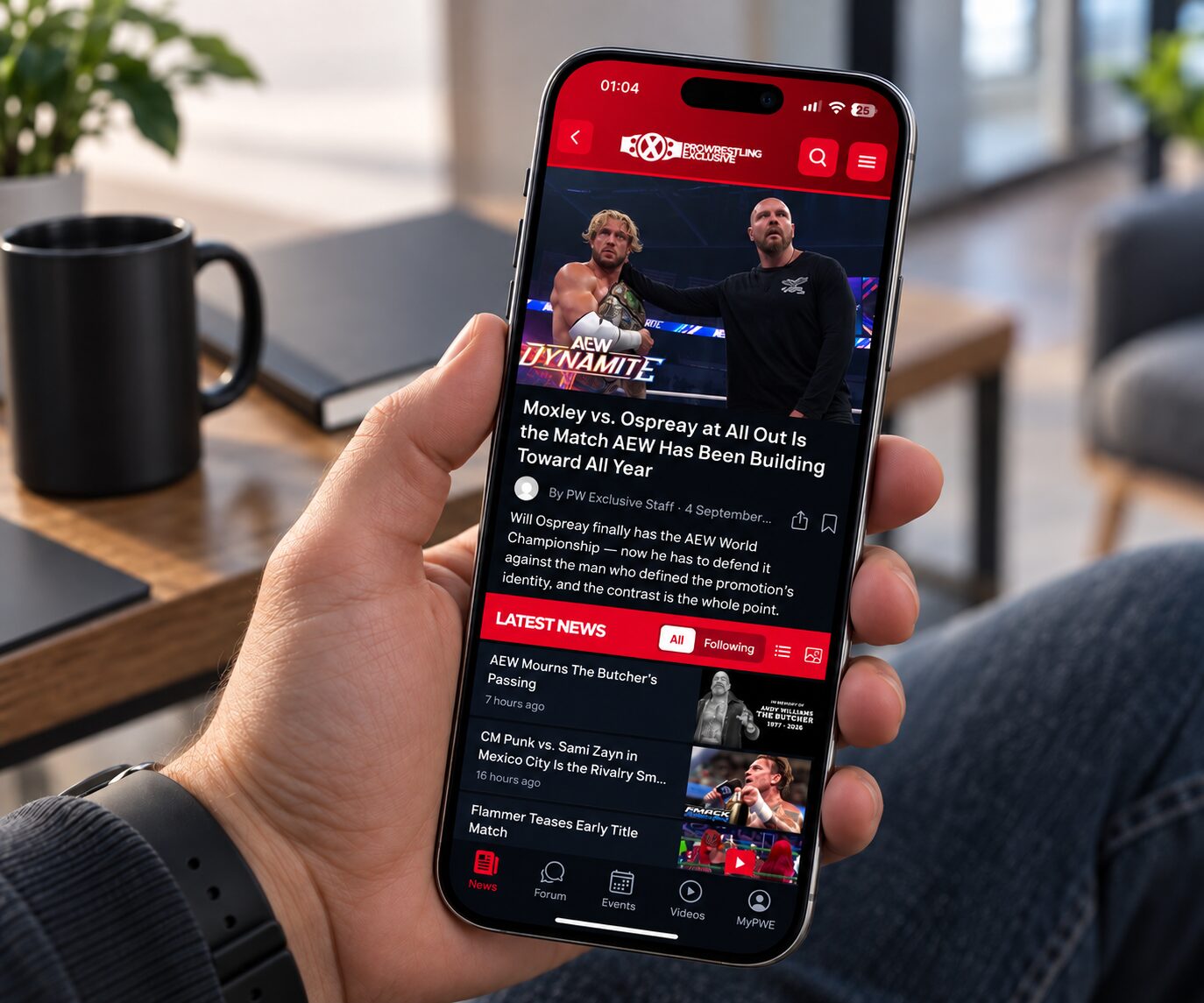 The Pro Wrestling Exclusive app in the hand